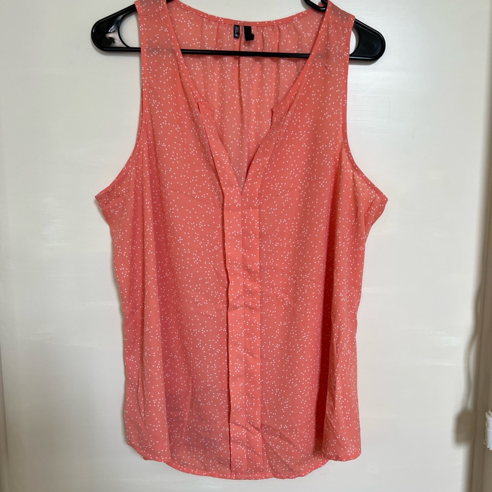 Peachy-orange sleeveless patterned blouse